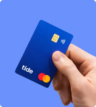 A blue Tide debit card held against a blue background.